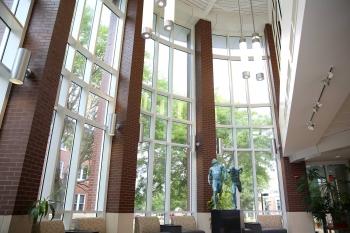 Inside east entrance, looking north. The featured sculpture "The Finish" was created by A. Thomas Schomberg '64. 